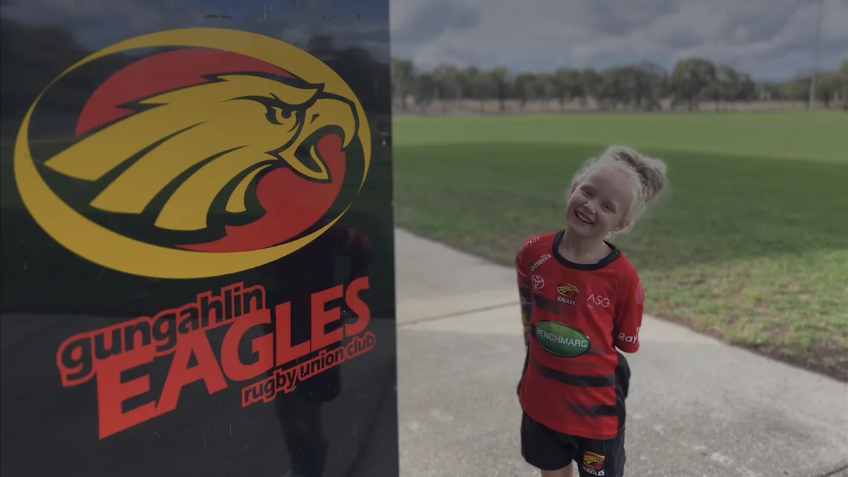 Digital key unlocking a personalized fan profile on a mobile app with loyalty rewards and sports icons.